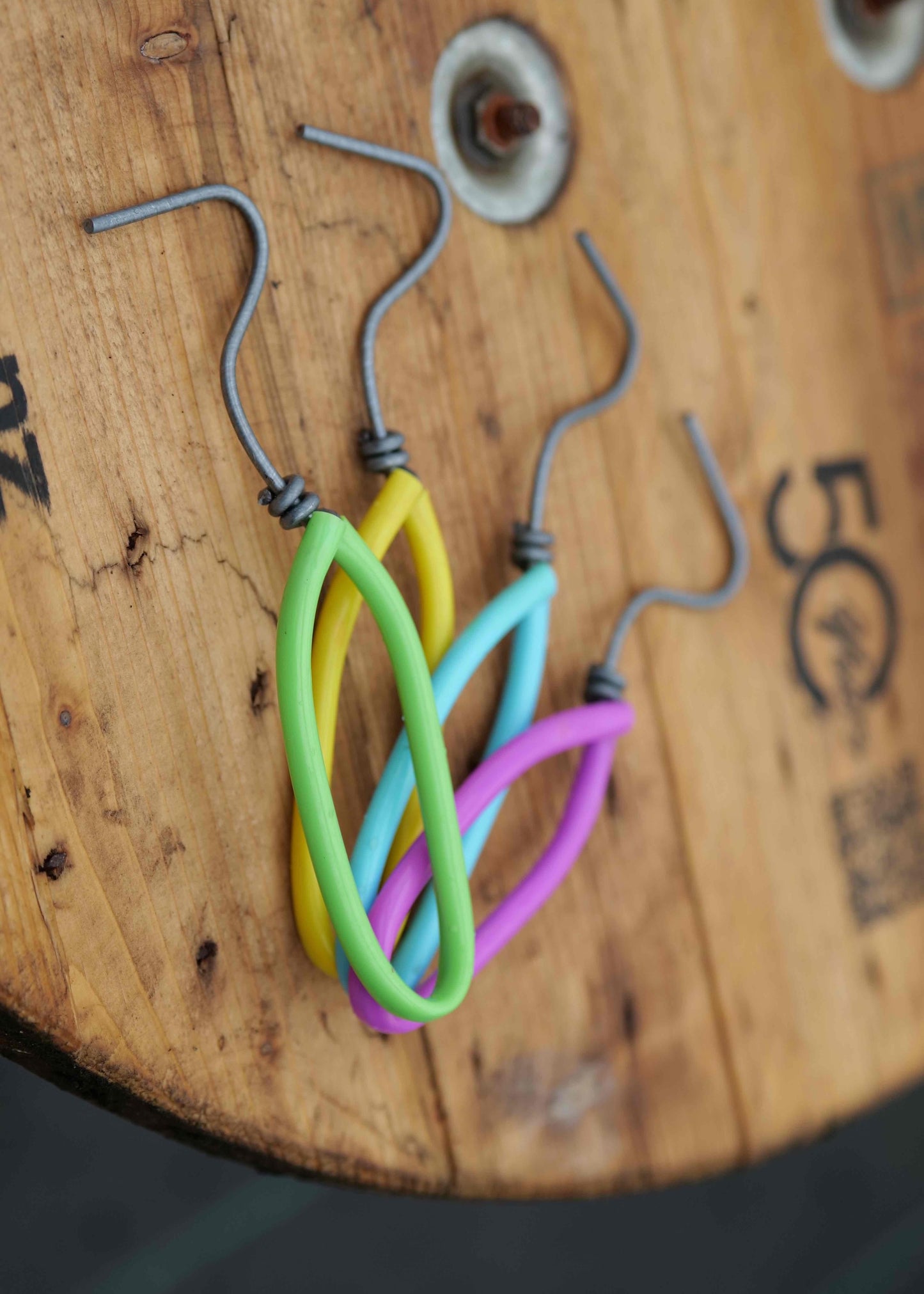 Colorful Weeding tools on a wooden surface